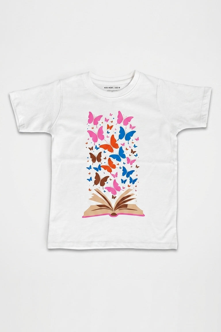 White t-shirt with a colorful butterfly design on an open book