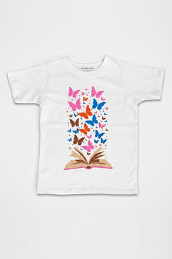 White t-shirt with a colorful butterfly design on an open book